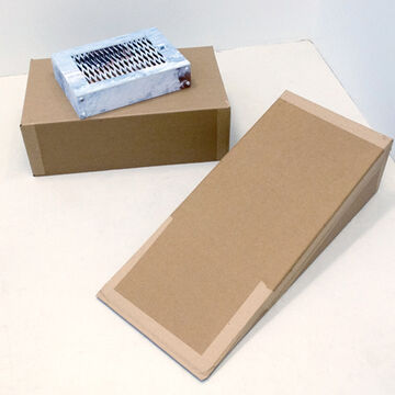 Two boxes, one rectangular, one triangular, with a painted metal grating on top of the rectangular box.