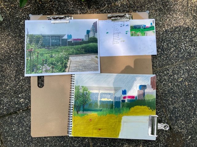 A clipboard with different aspects of a painting