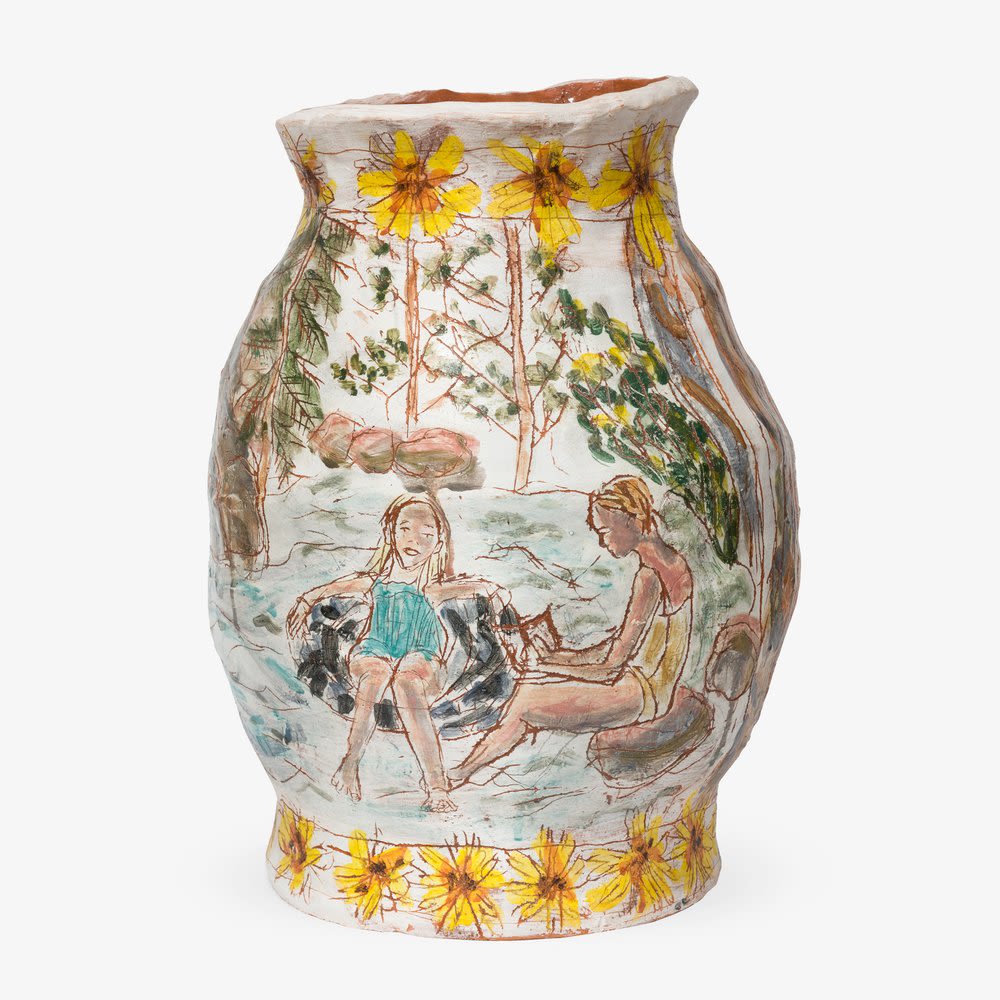 A ceramic artwork with women bathing 