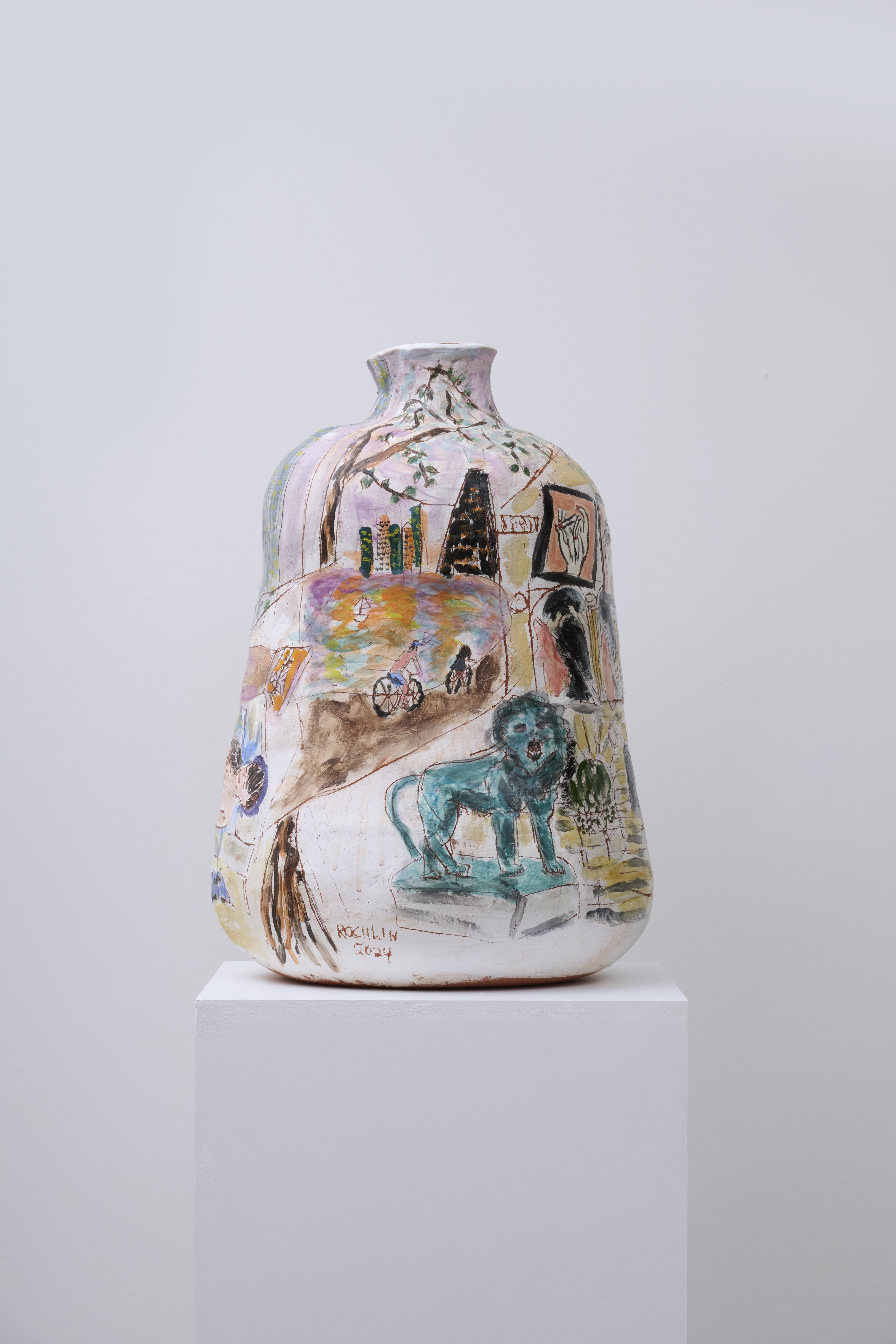 A ceramic vessel with a teal lion