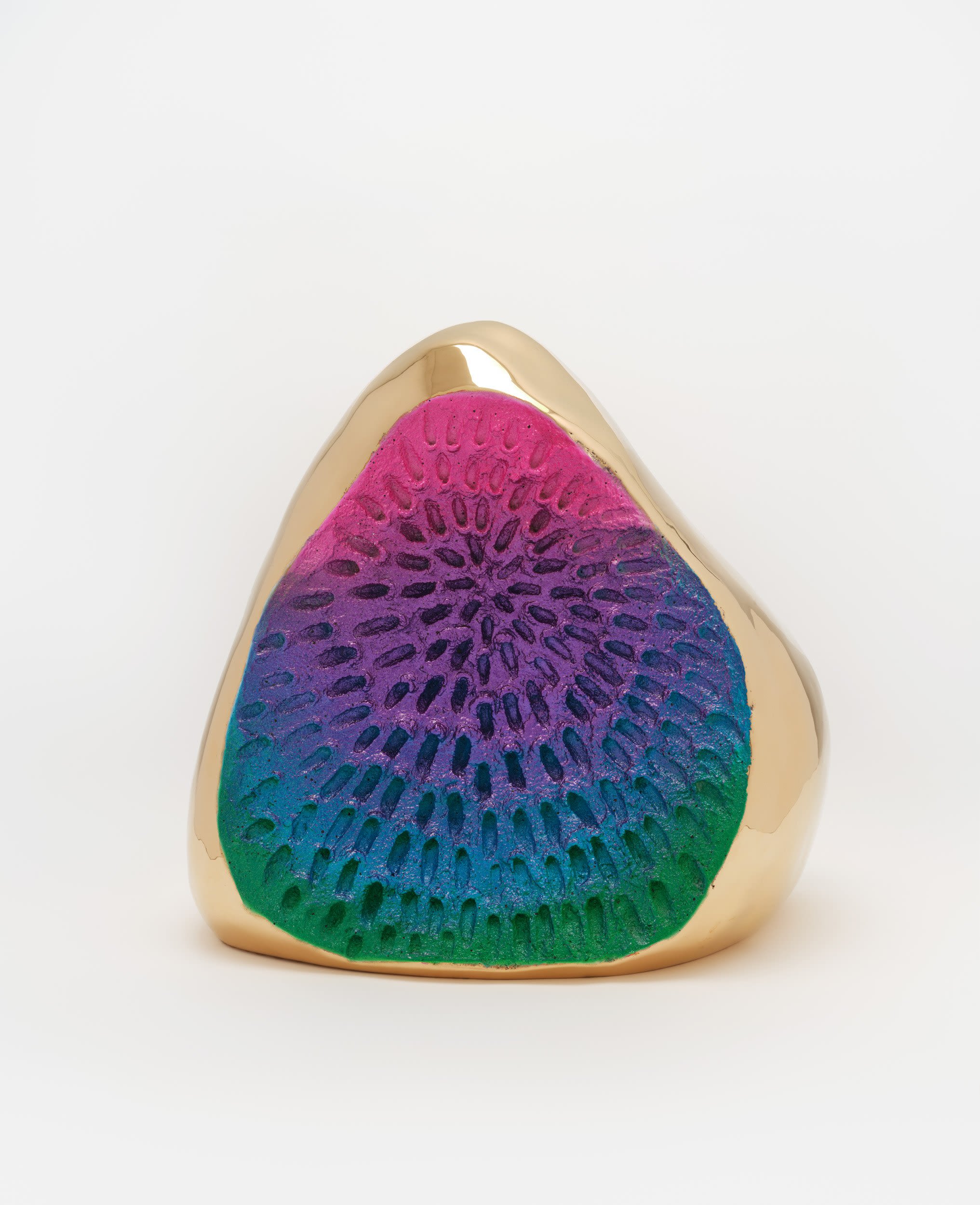 A gold rainbow sculpture 