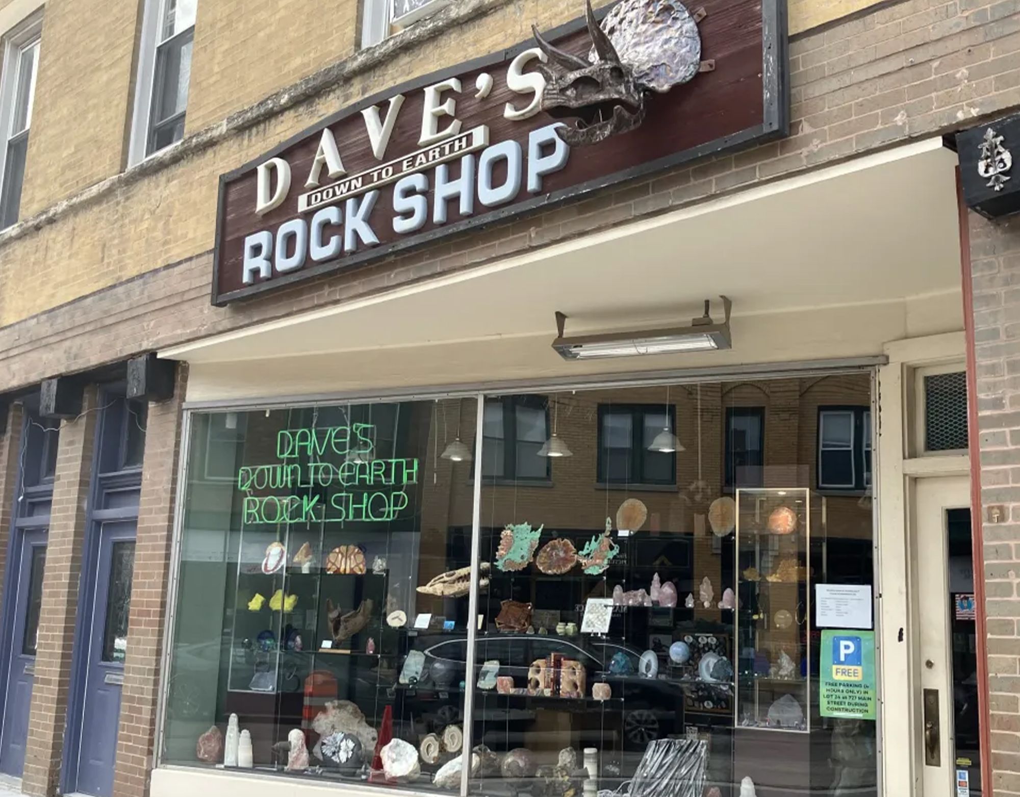 A storefront with crystals, rocks, and geodes