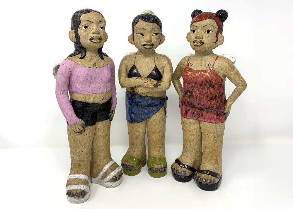 Three sculptures of girls