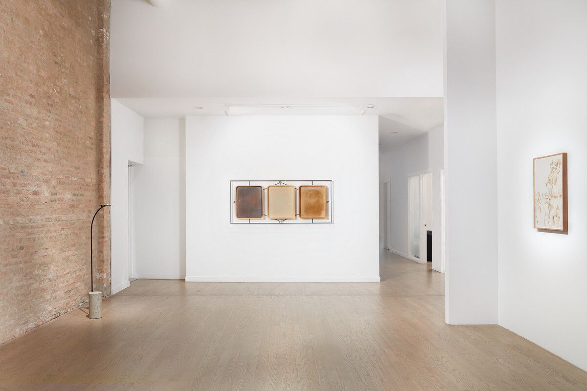 A gallery space with white walls and art on display
