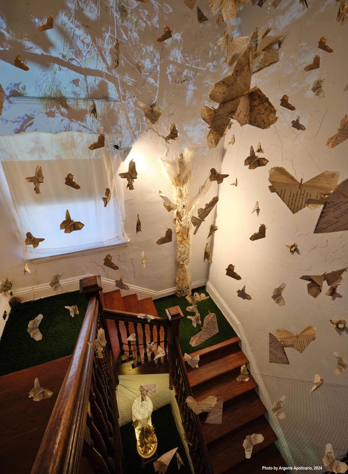 Projections and paper scupltures take over a staircase
