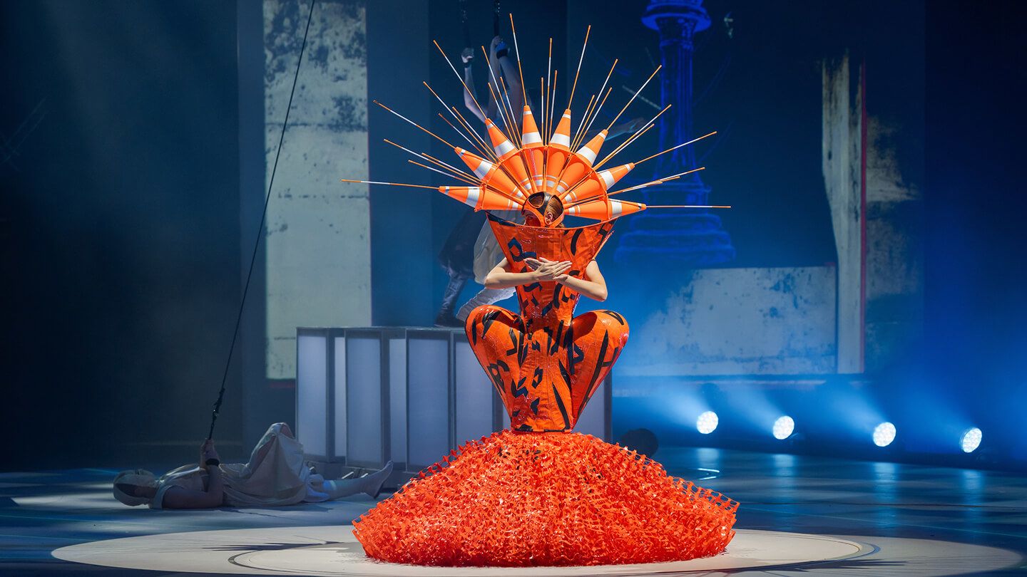 A fashion design featuring a crown of traffic cones