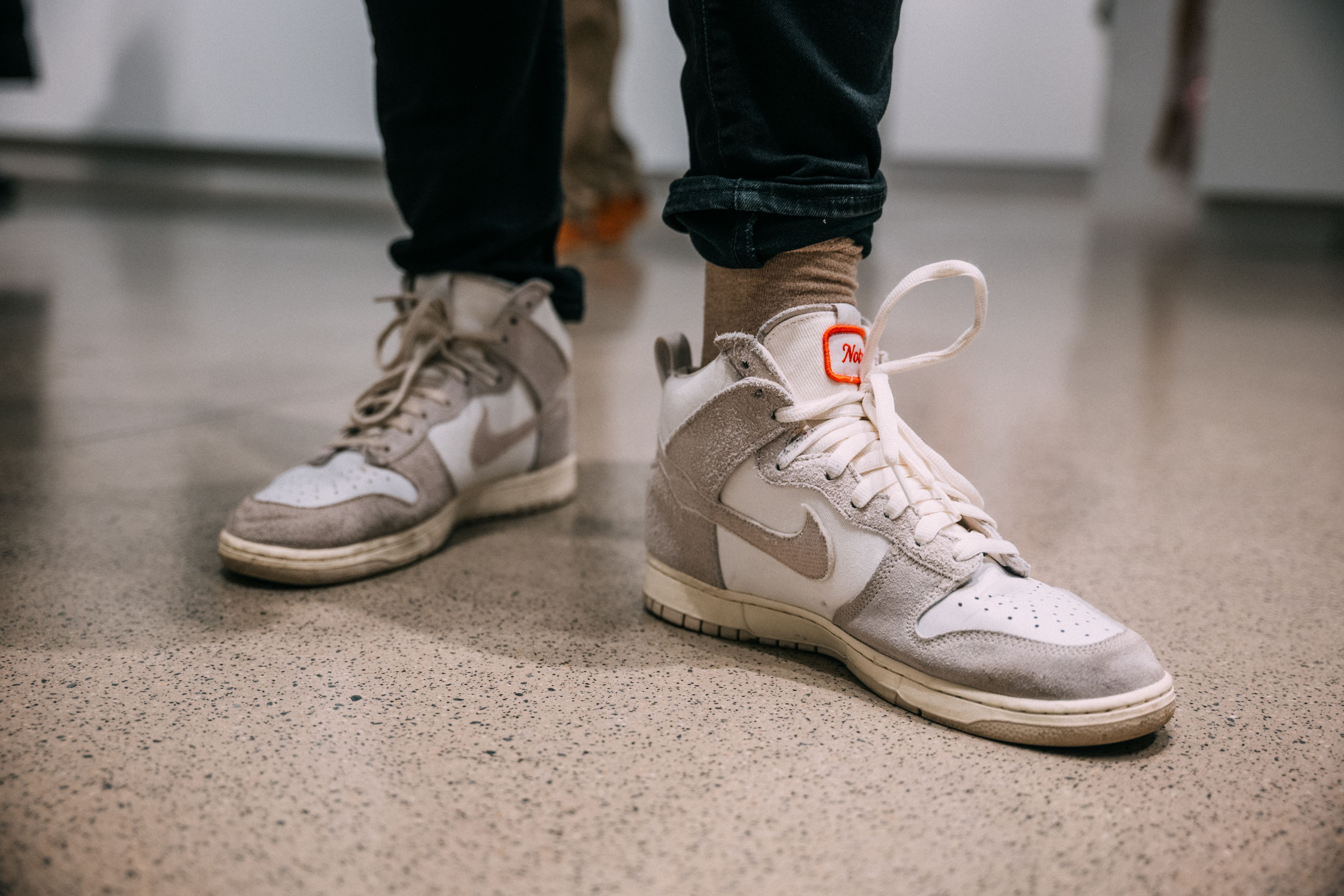 A close-up of the student's white Nikes.