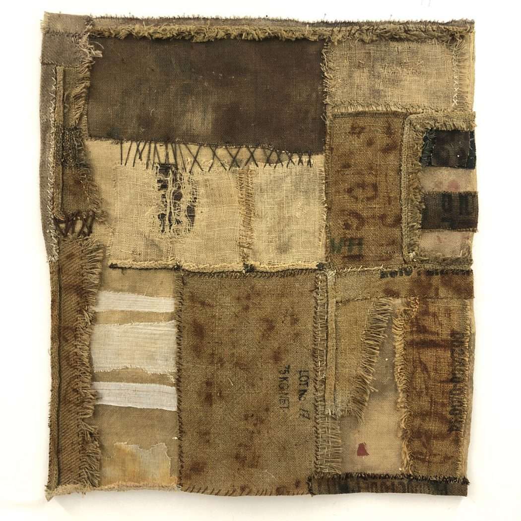 Fiber art of strips of brown and beige fabric