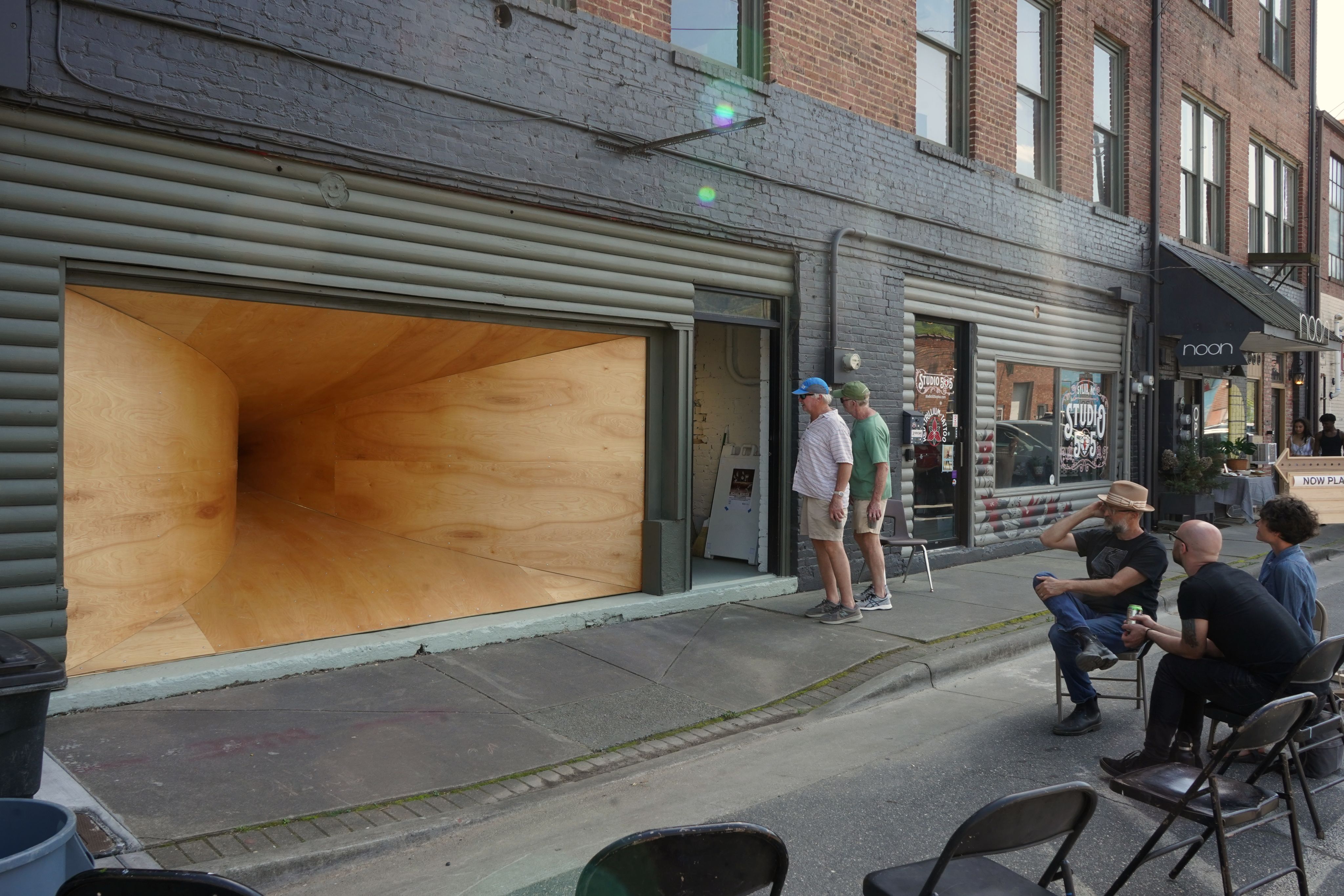A wooden tunnel erected in a storefront