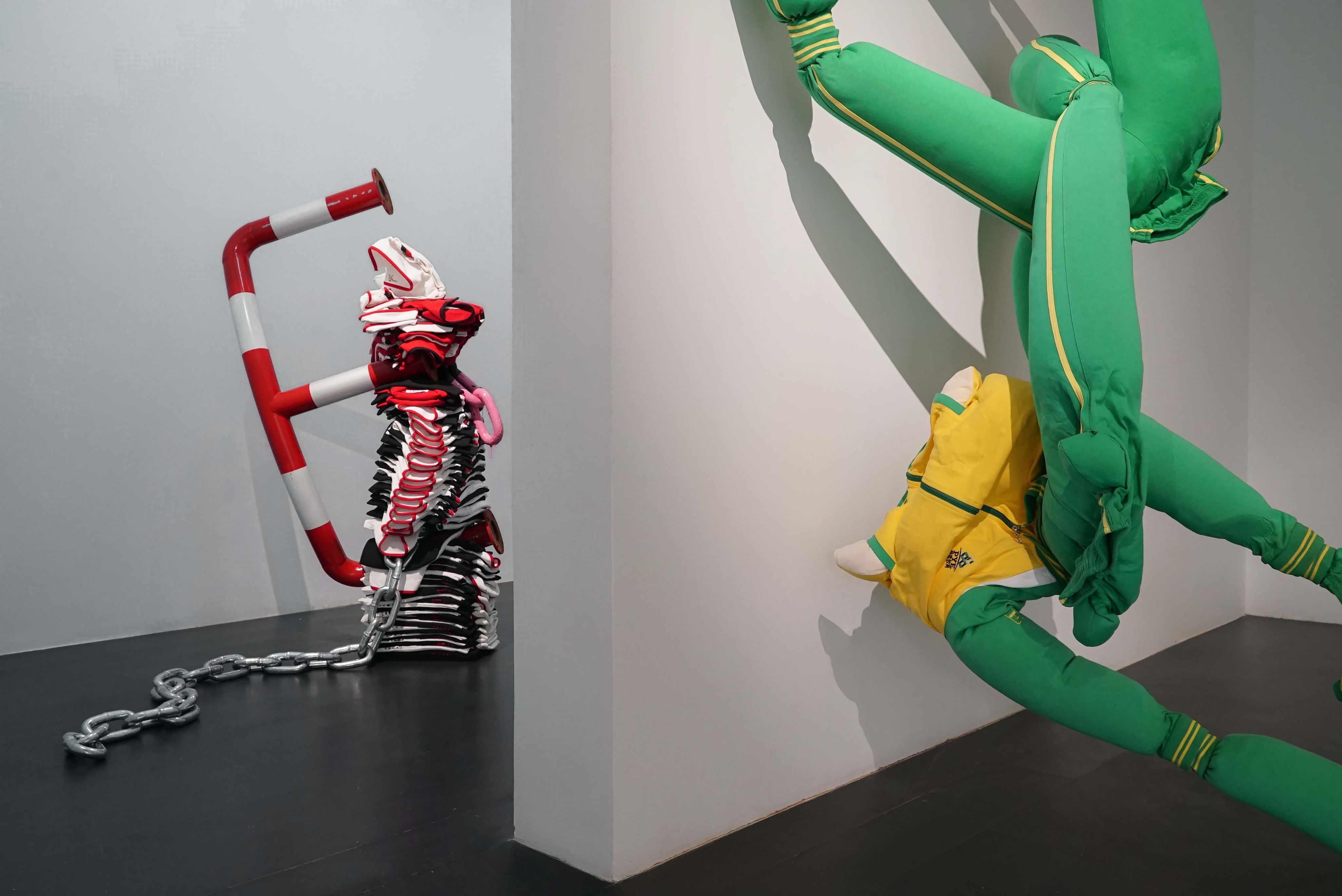 Primary colored sculptures in a gallery space