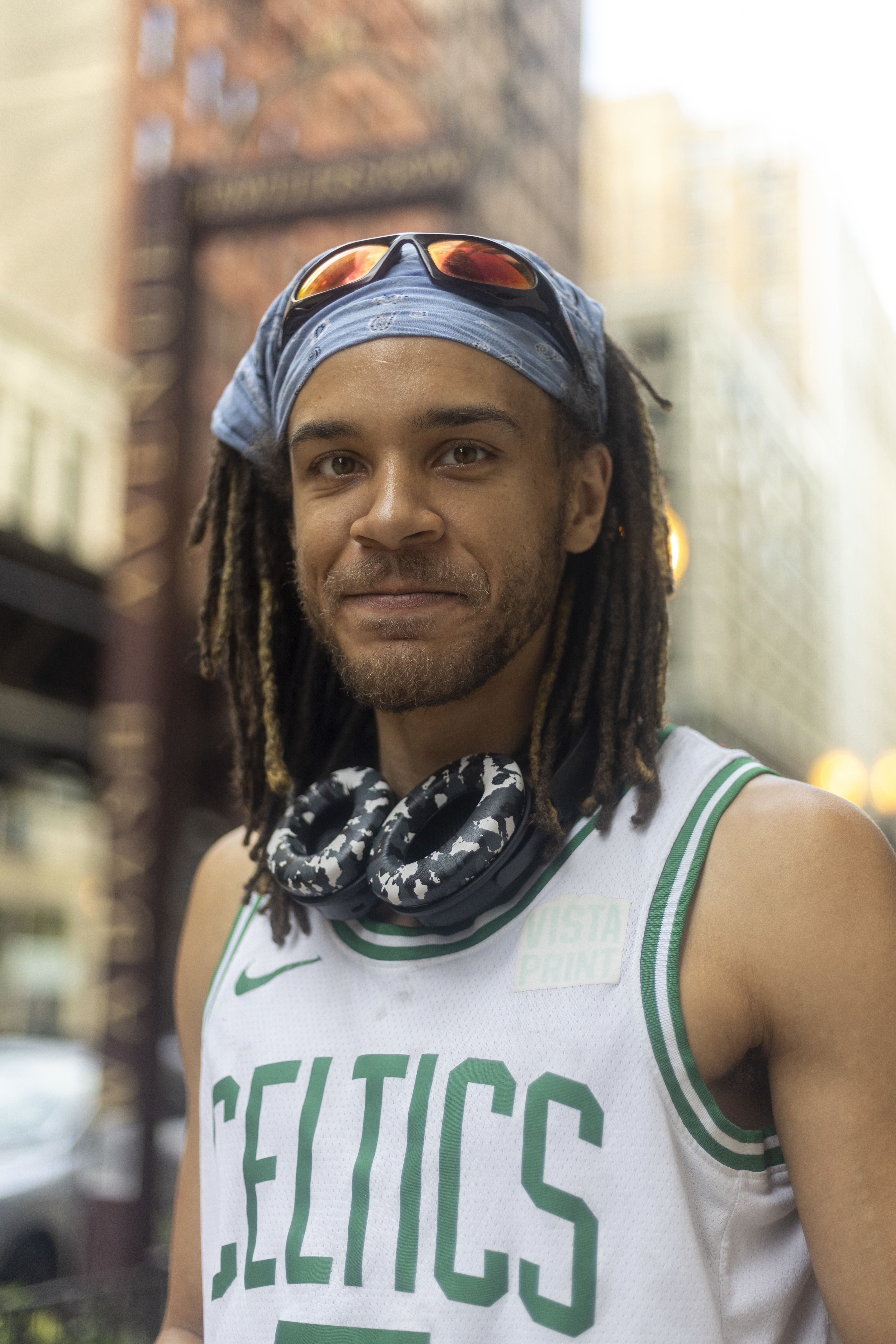 A student in a Celtics jersey. 