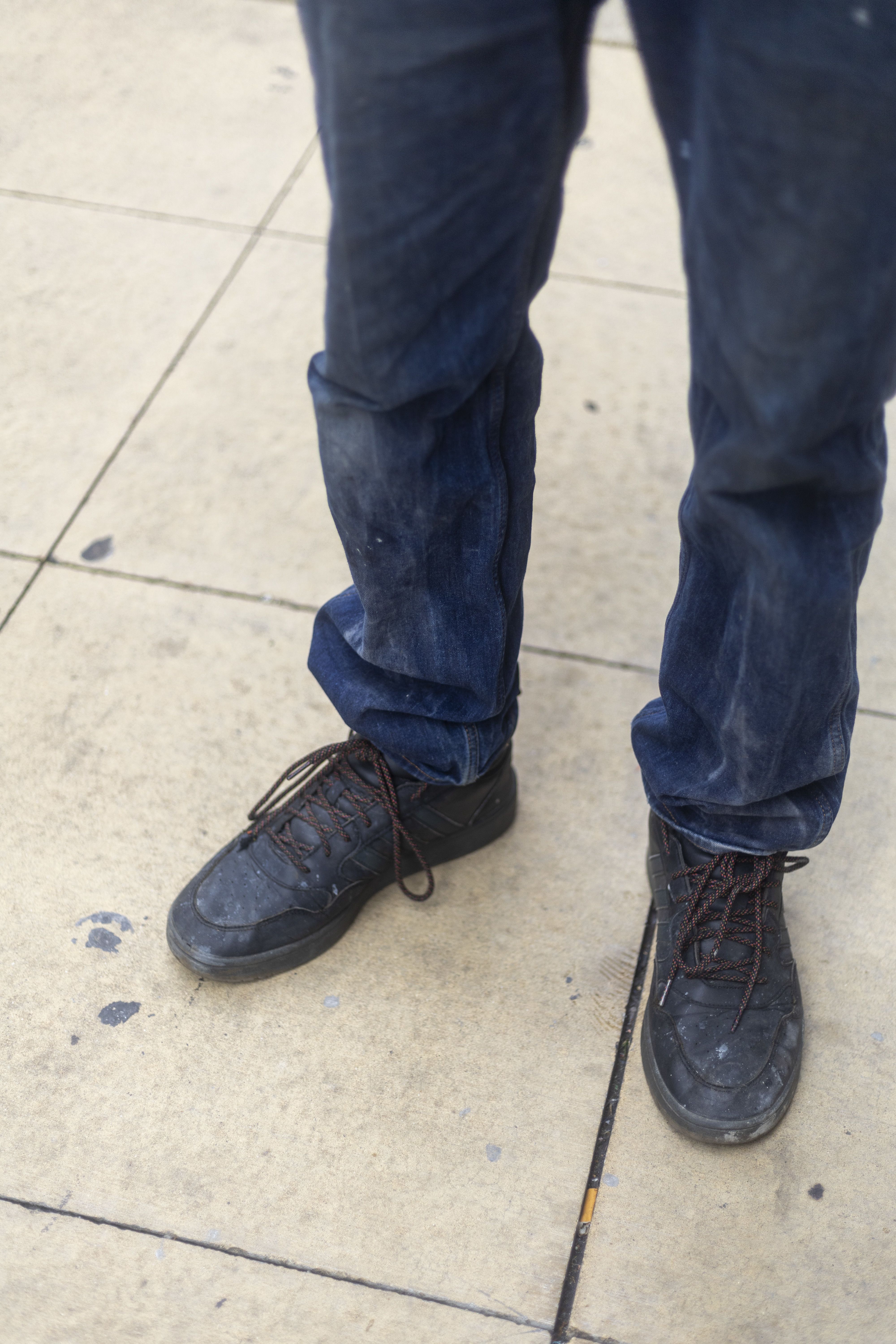 Blue jeans and black sneakers