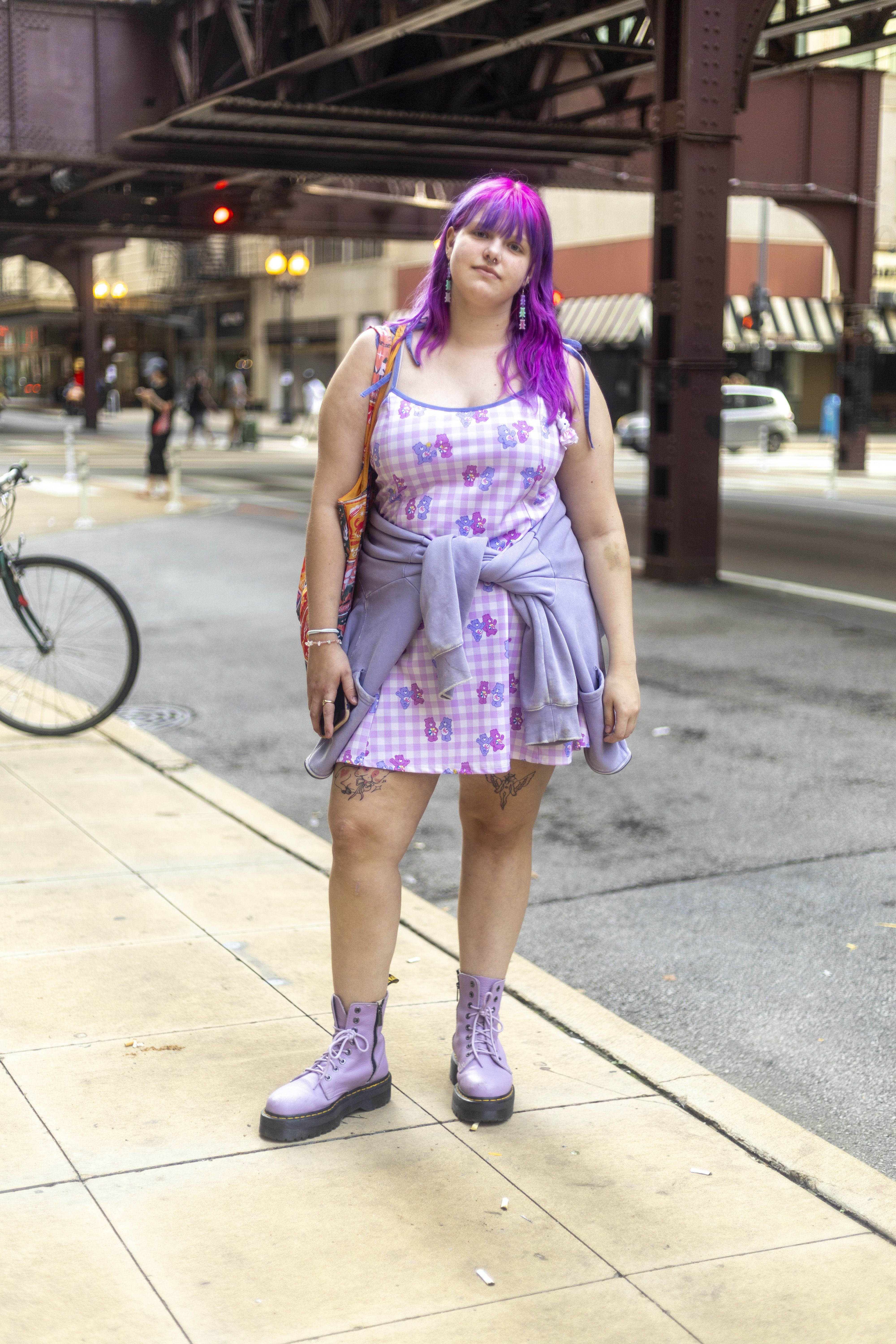 A student with purple hair in a purple outfit