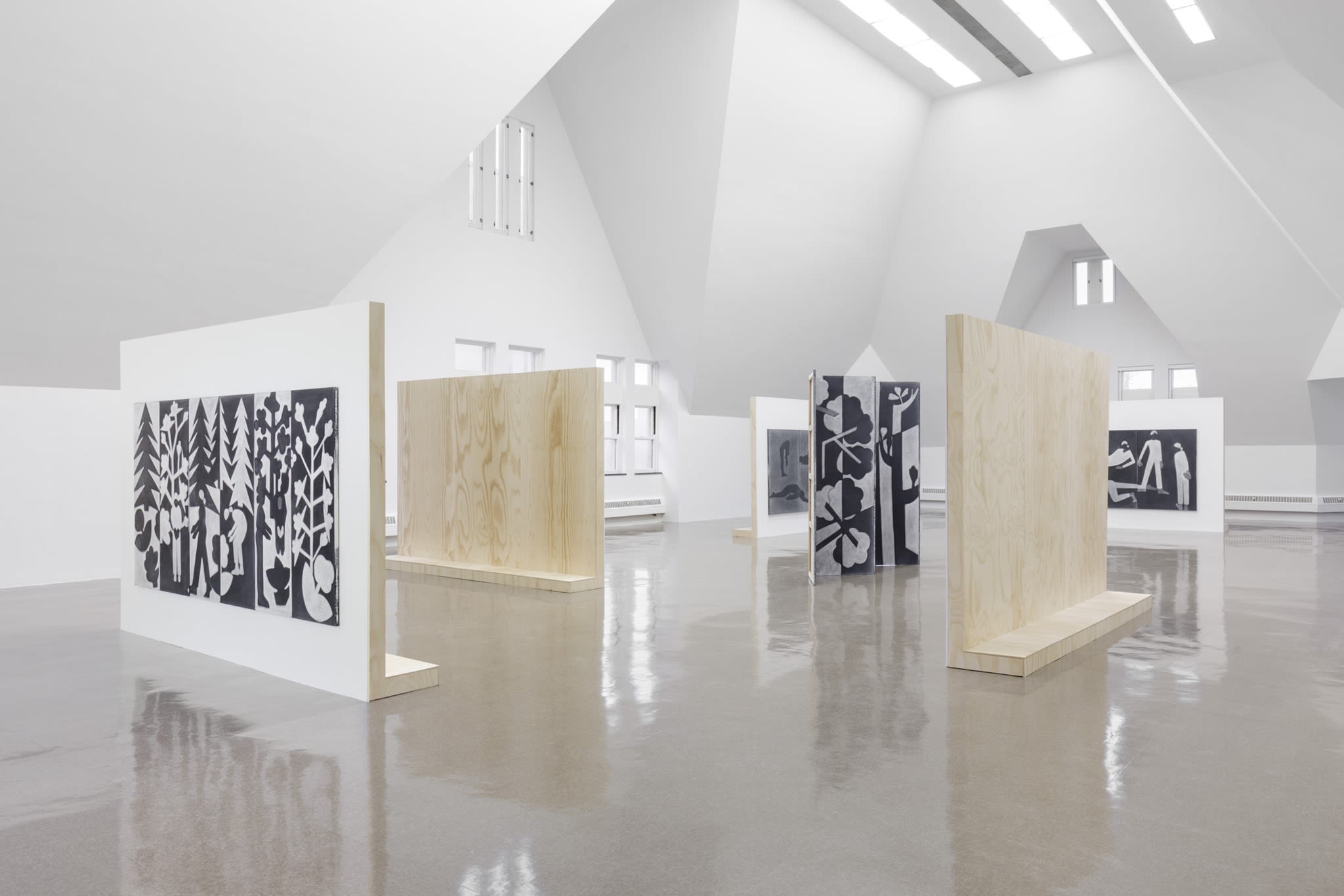 Black and white large scale works in a modern gallery space