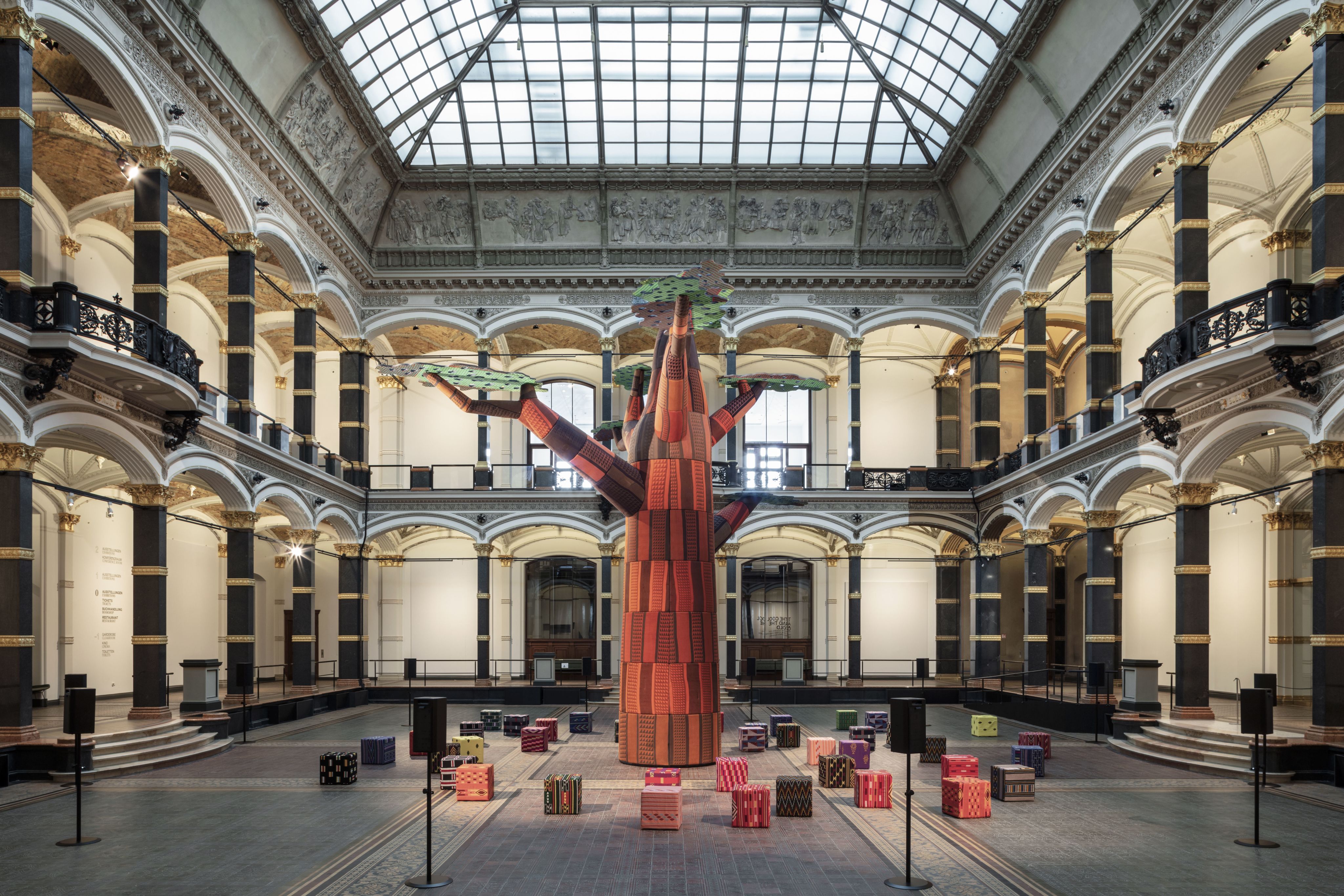 A large sculptural installation in a glass-ceilinged gallery space 
