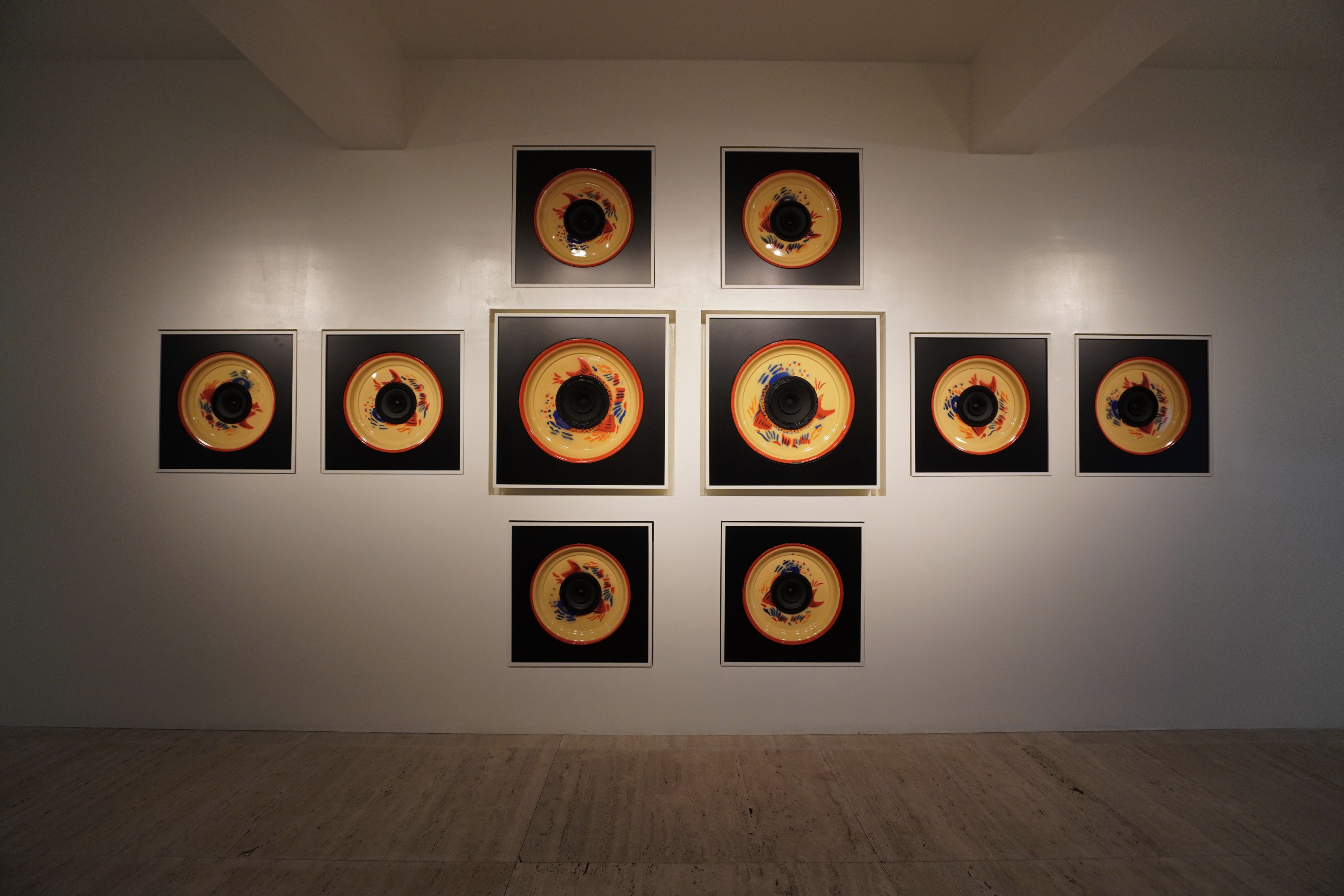 Square art installations on a gallery wall