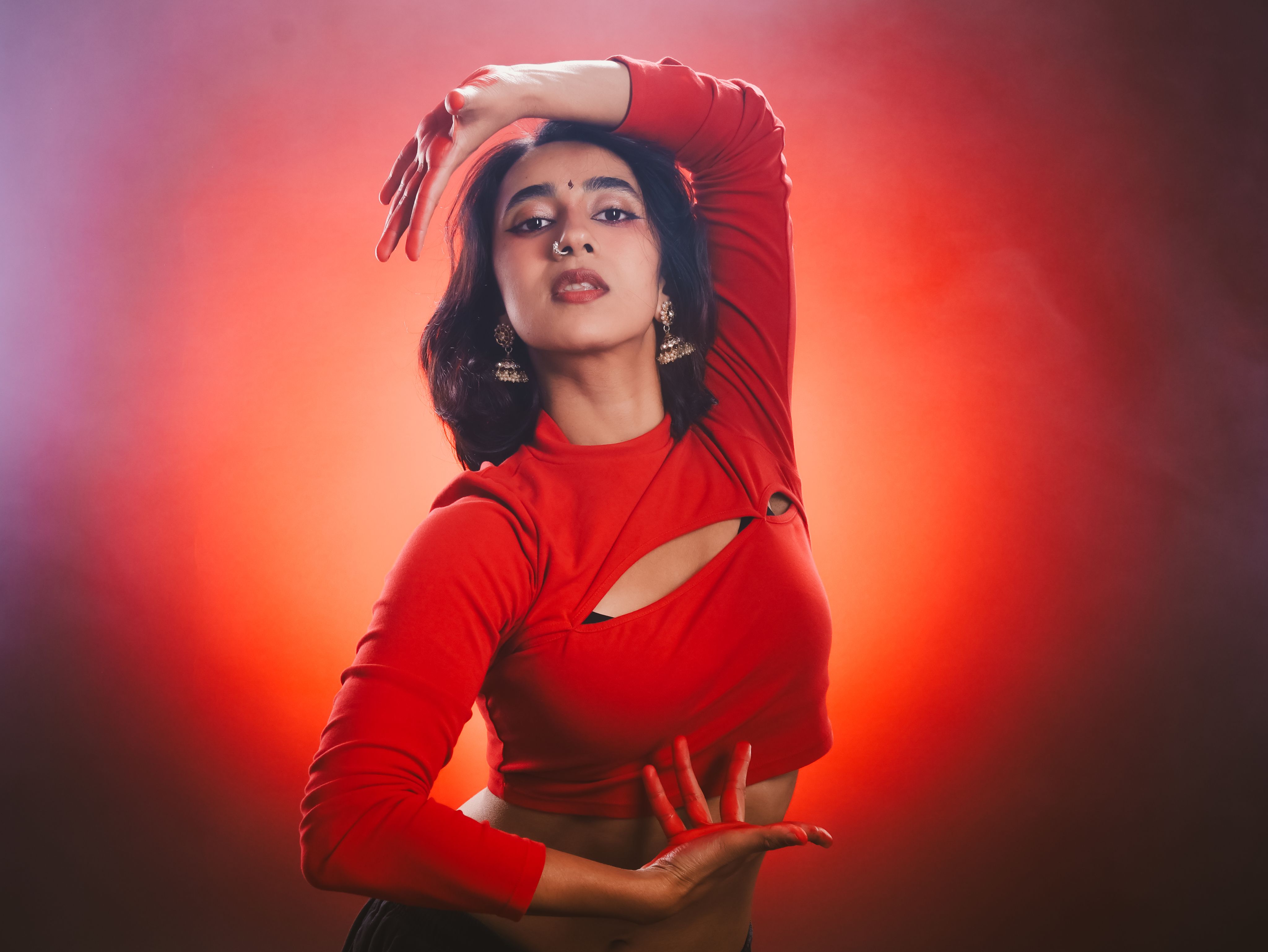 A photo of a performer in red