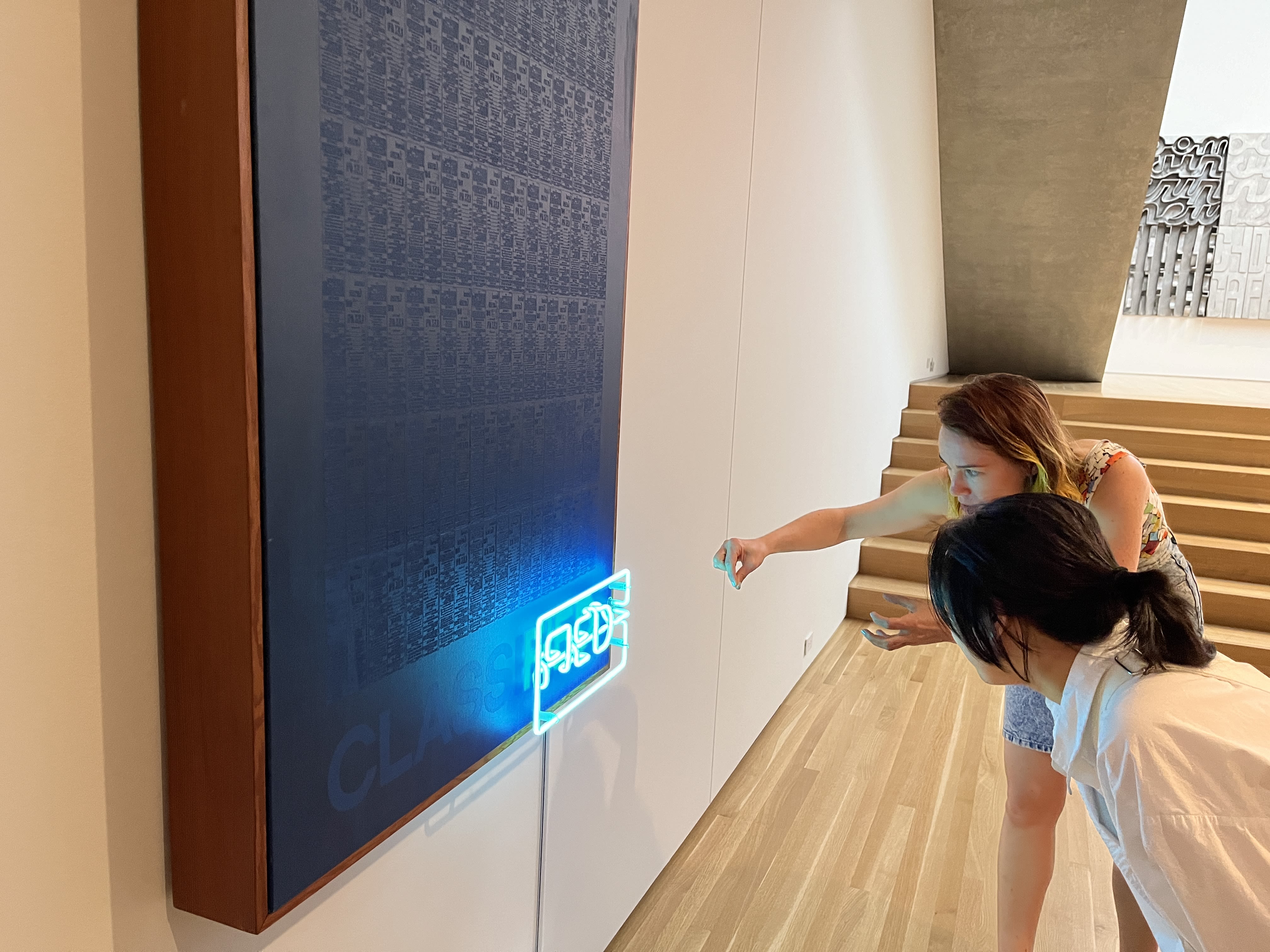 A gallery space with neon