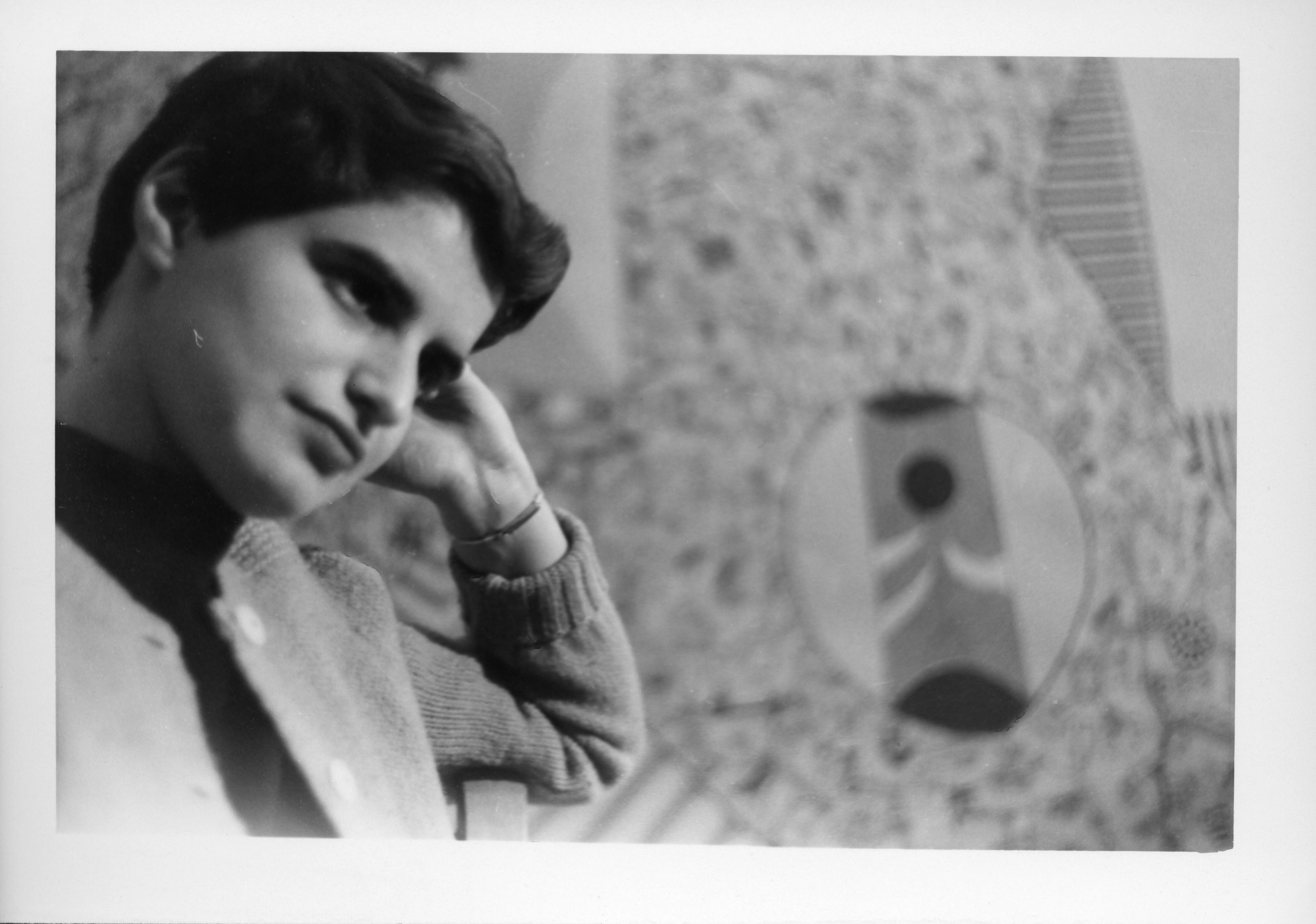 a black and white photo of a young woman