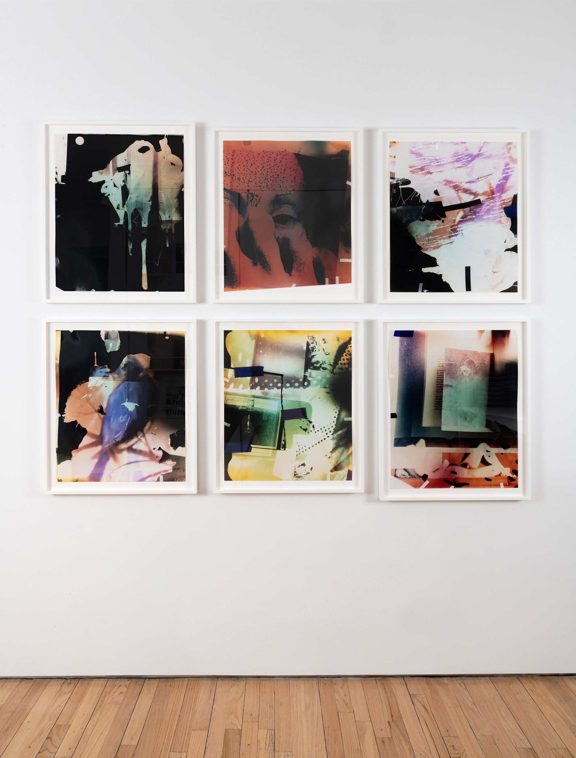 An installation view of six saturated, colored photos on a white gallery wall