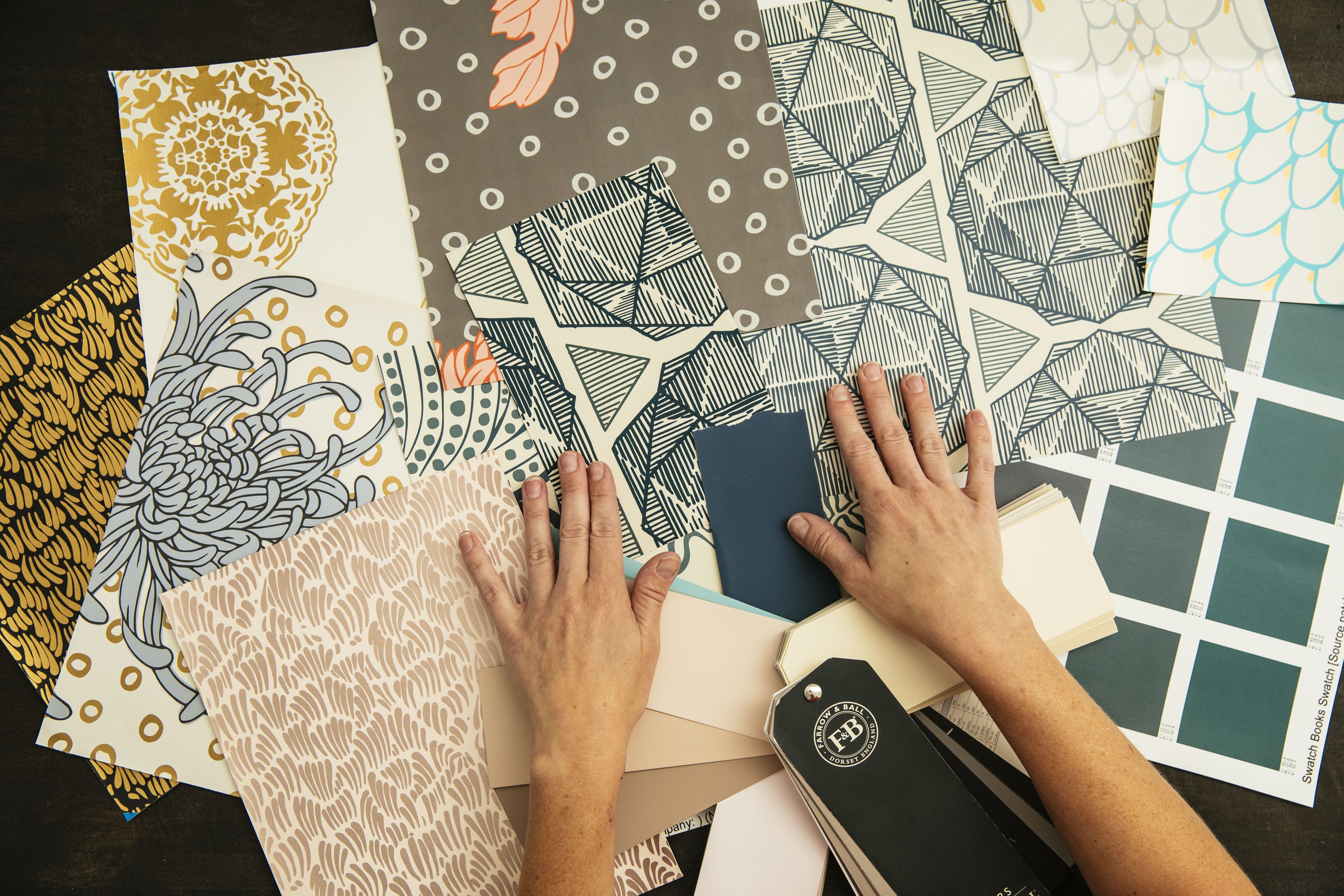 Wallpaper samples spread on a table