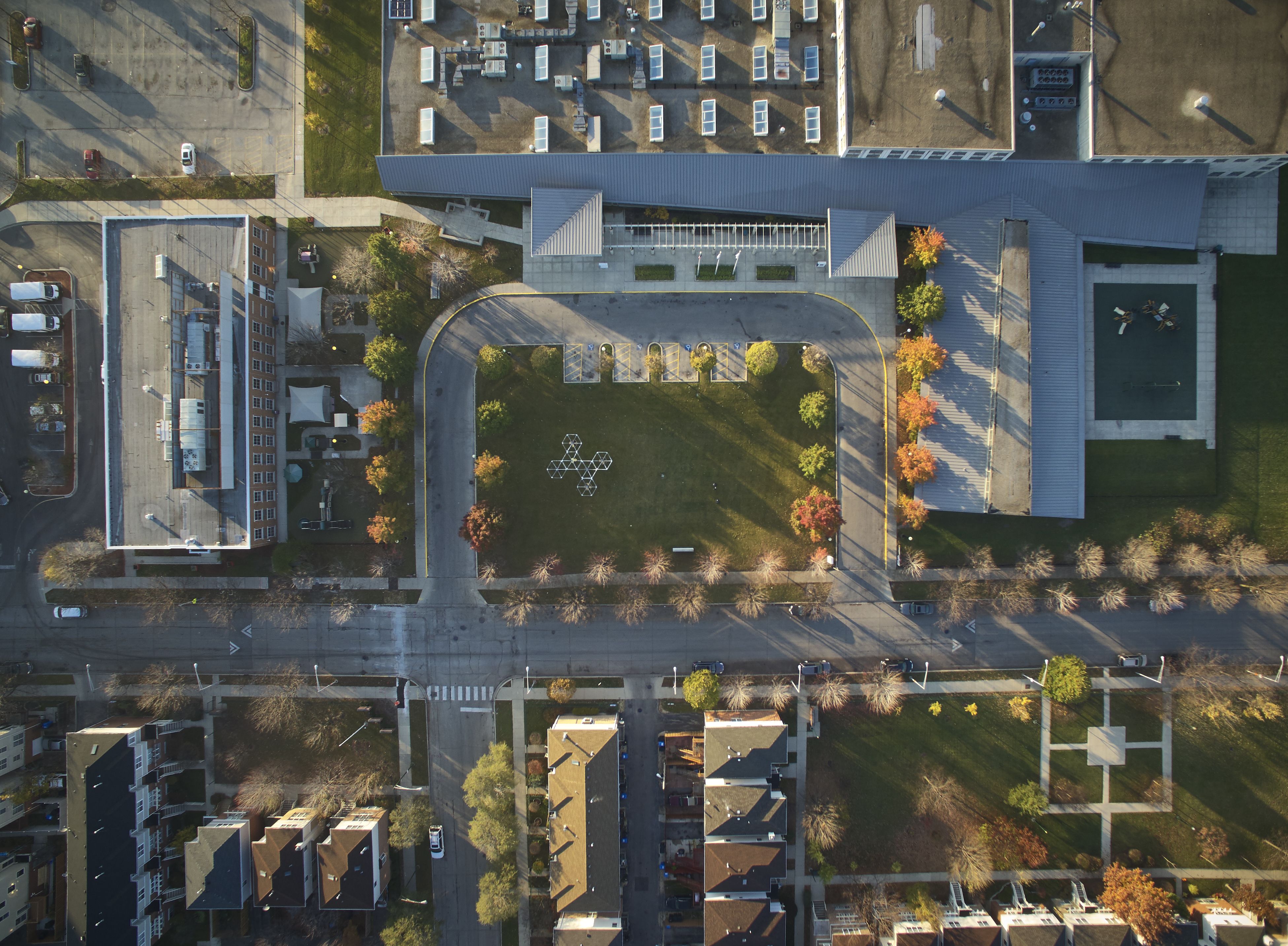 An aerial view of a Chicago building and neighboring houses