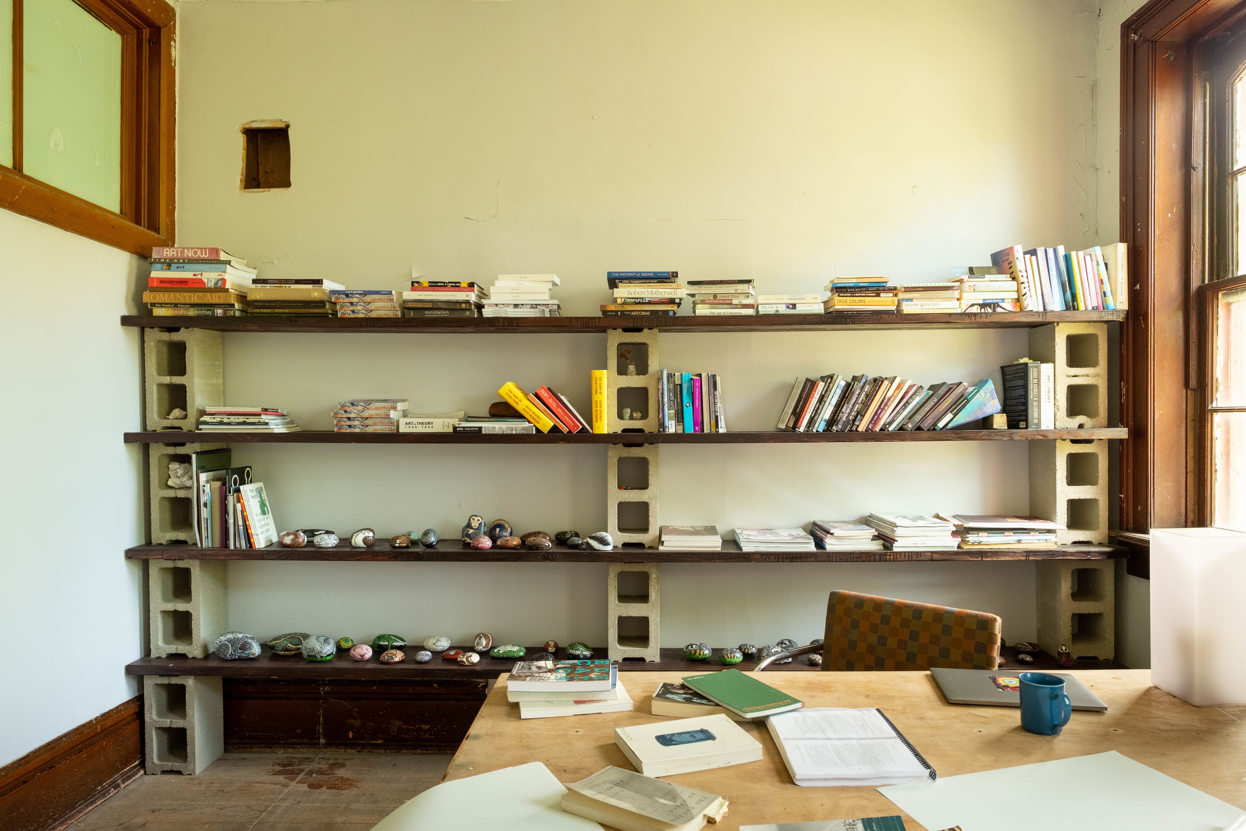 A bookshelf with scattered objects