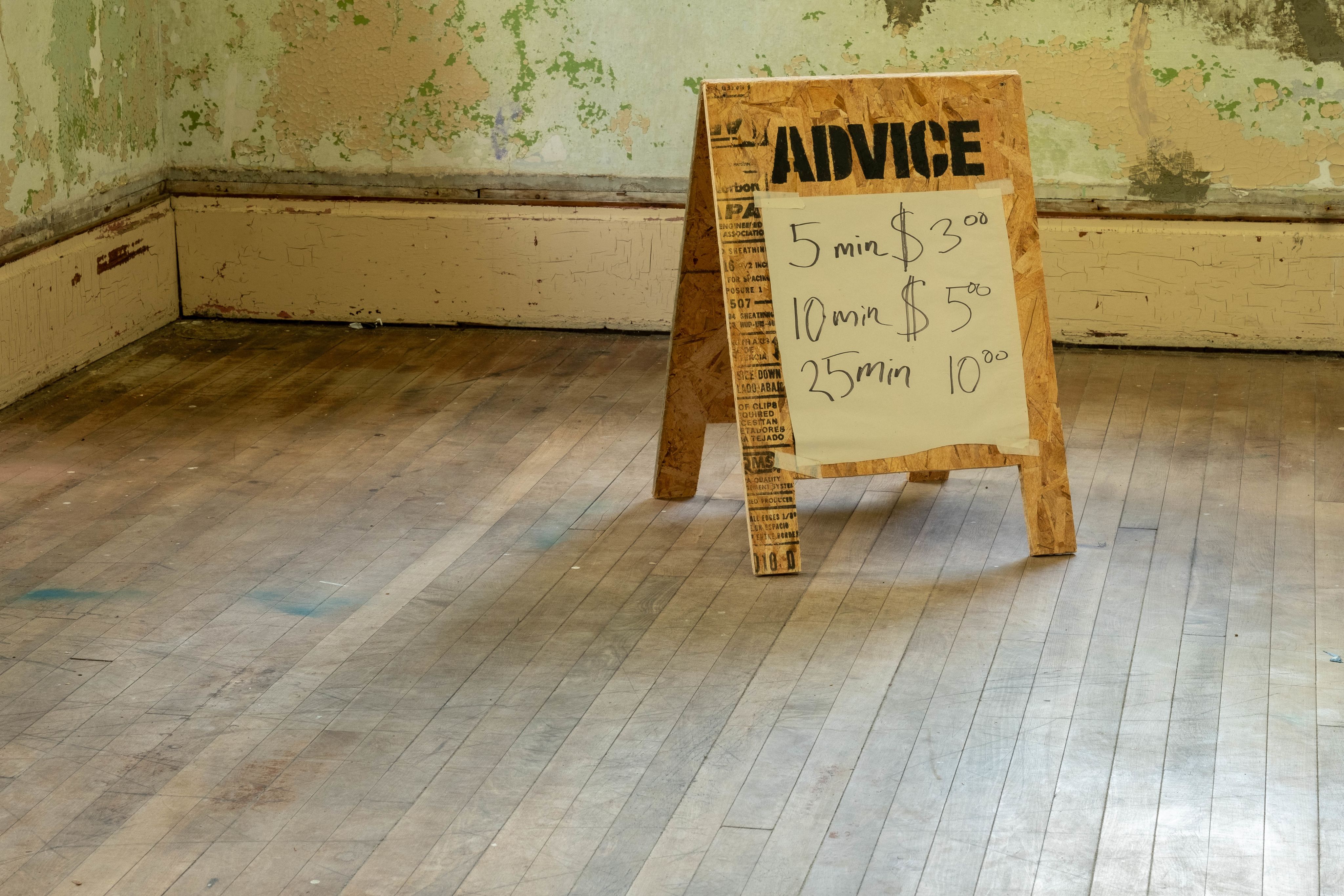 A sign advertising paid advice 