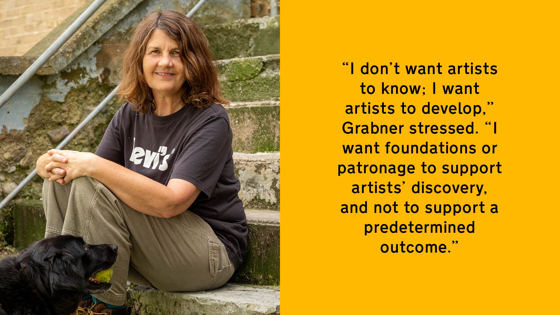 Michelle Grabner sits on some steps with her dog