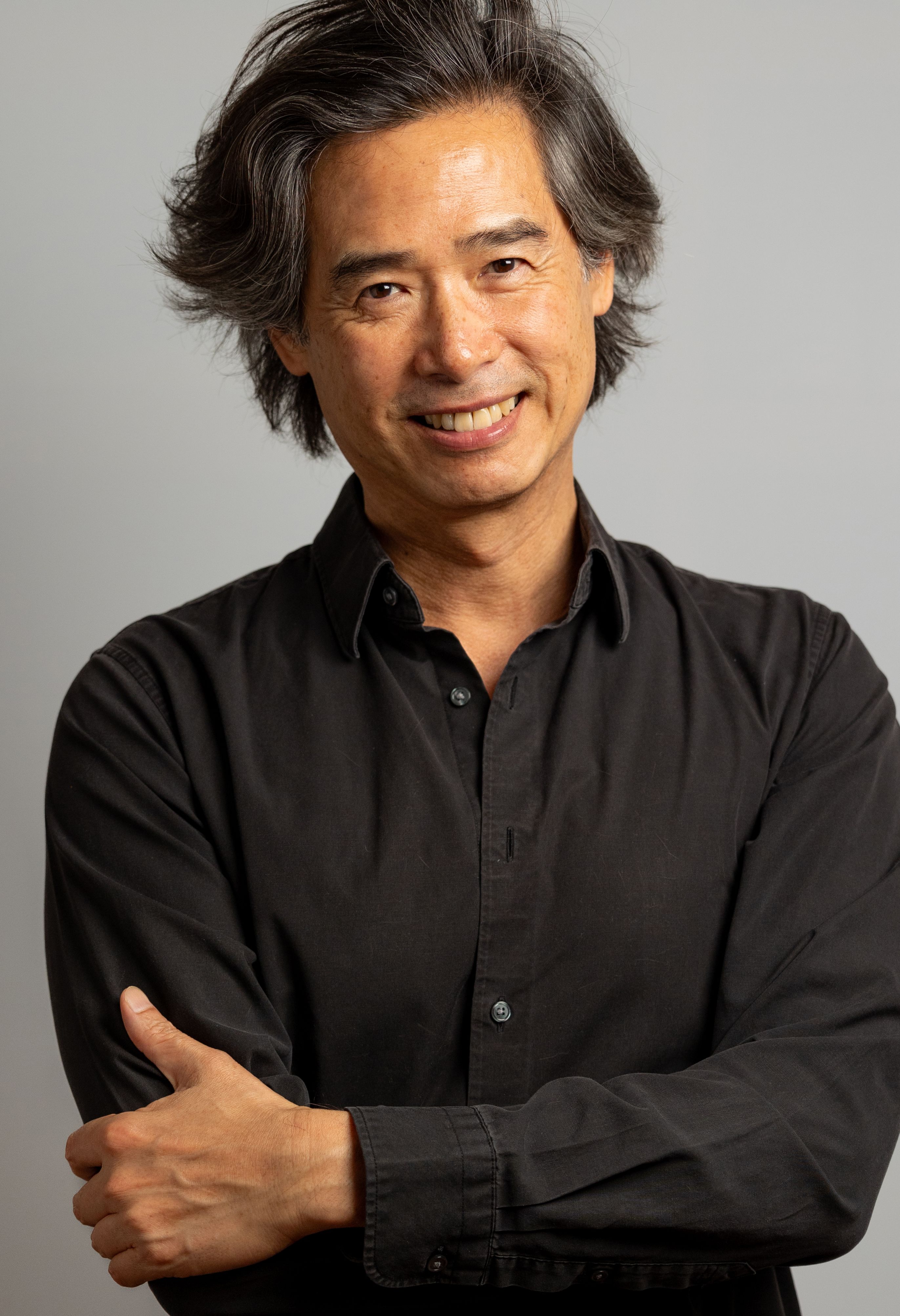 A portrait of an artist in a black shirt