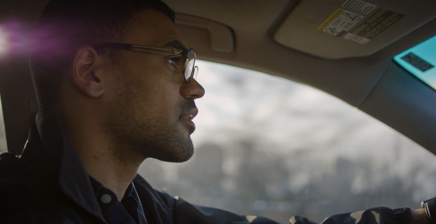 Close up of Gabriel Bump's face as he drives a car