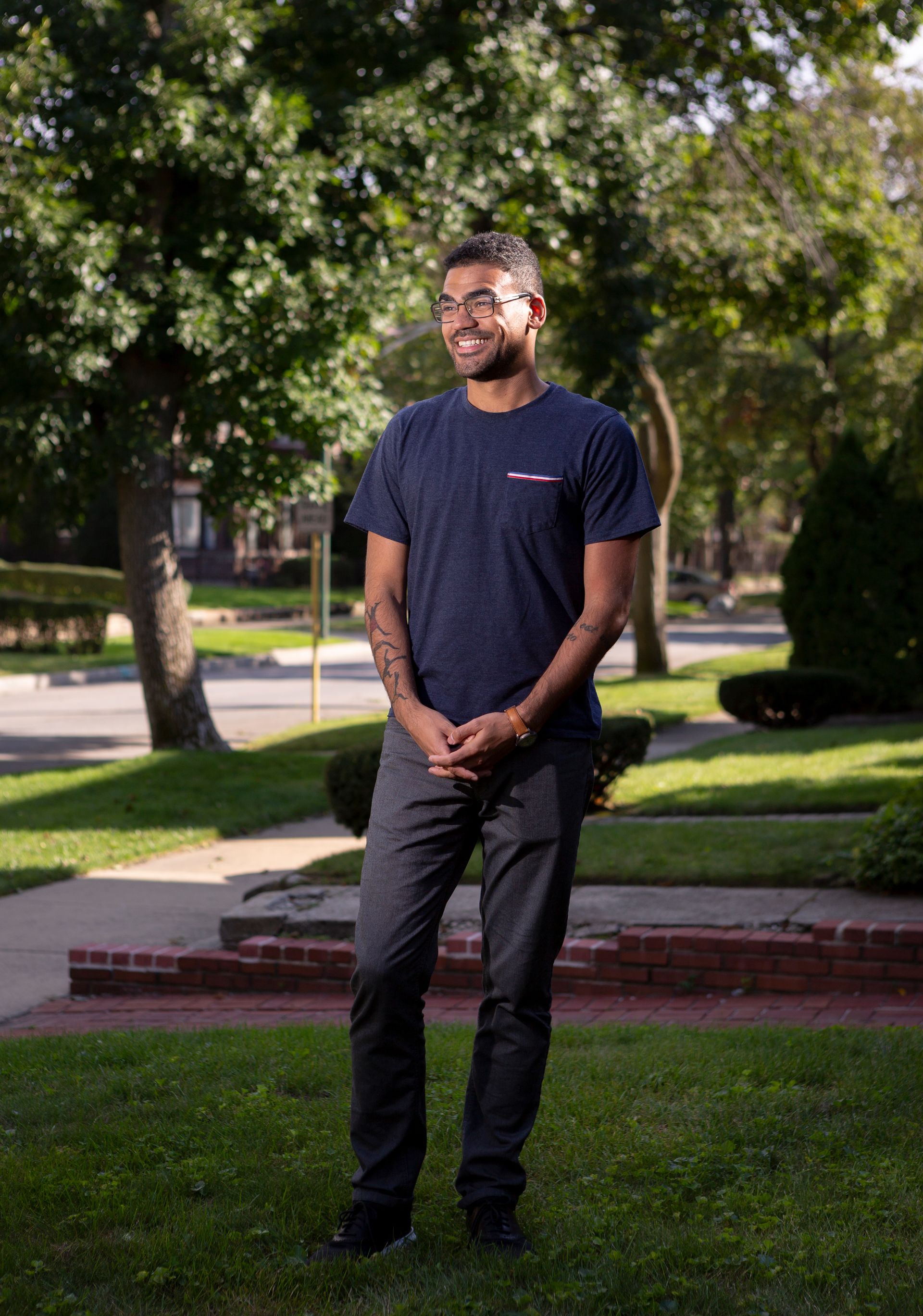 Gabriel Bump stands on the front lawn in a Chicago neighborhood