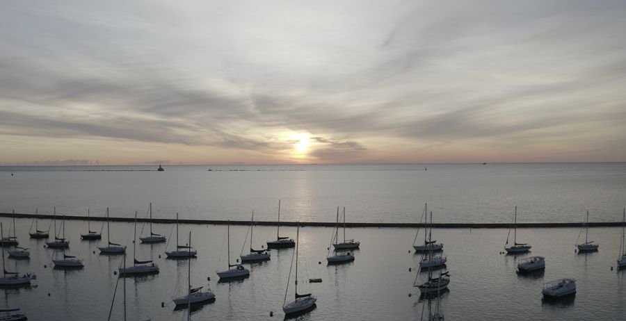 Boats in a harbor of Lake Michigan before sunset
