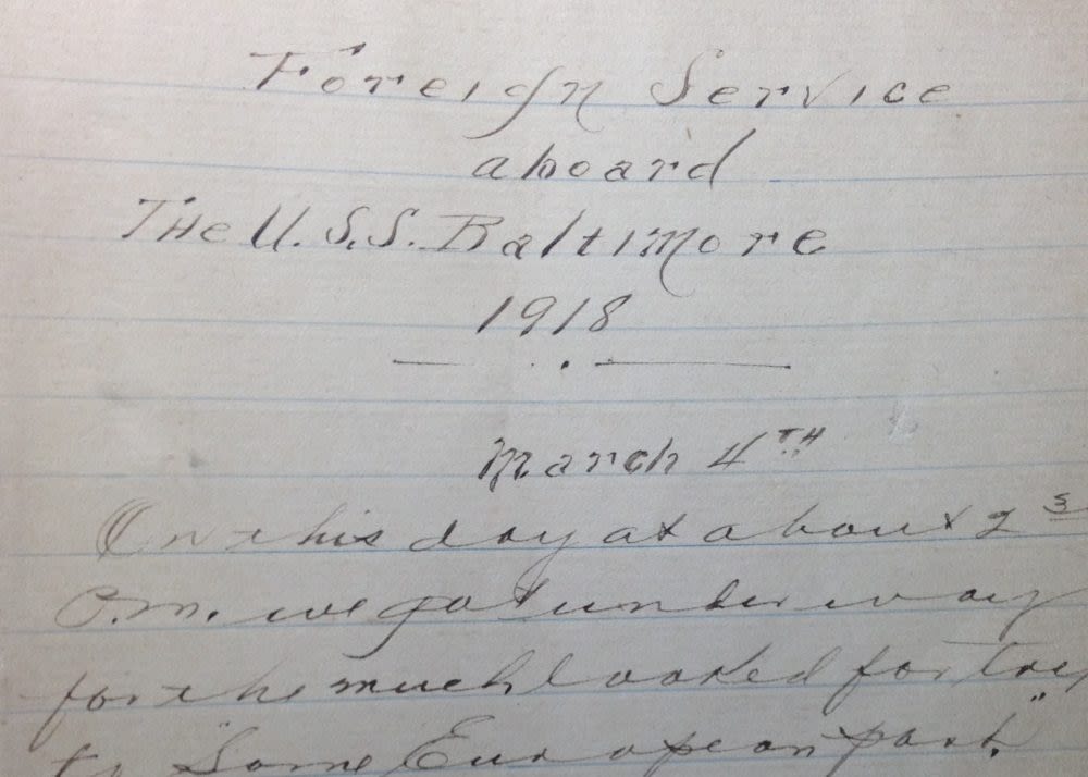 A woman in all black reclines on an orange object