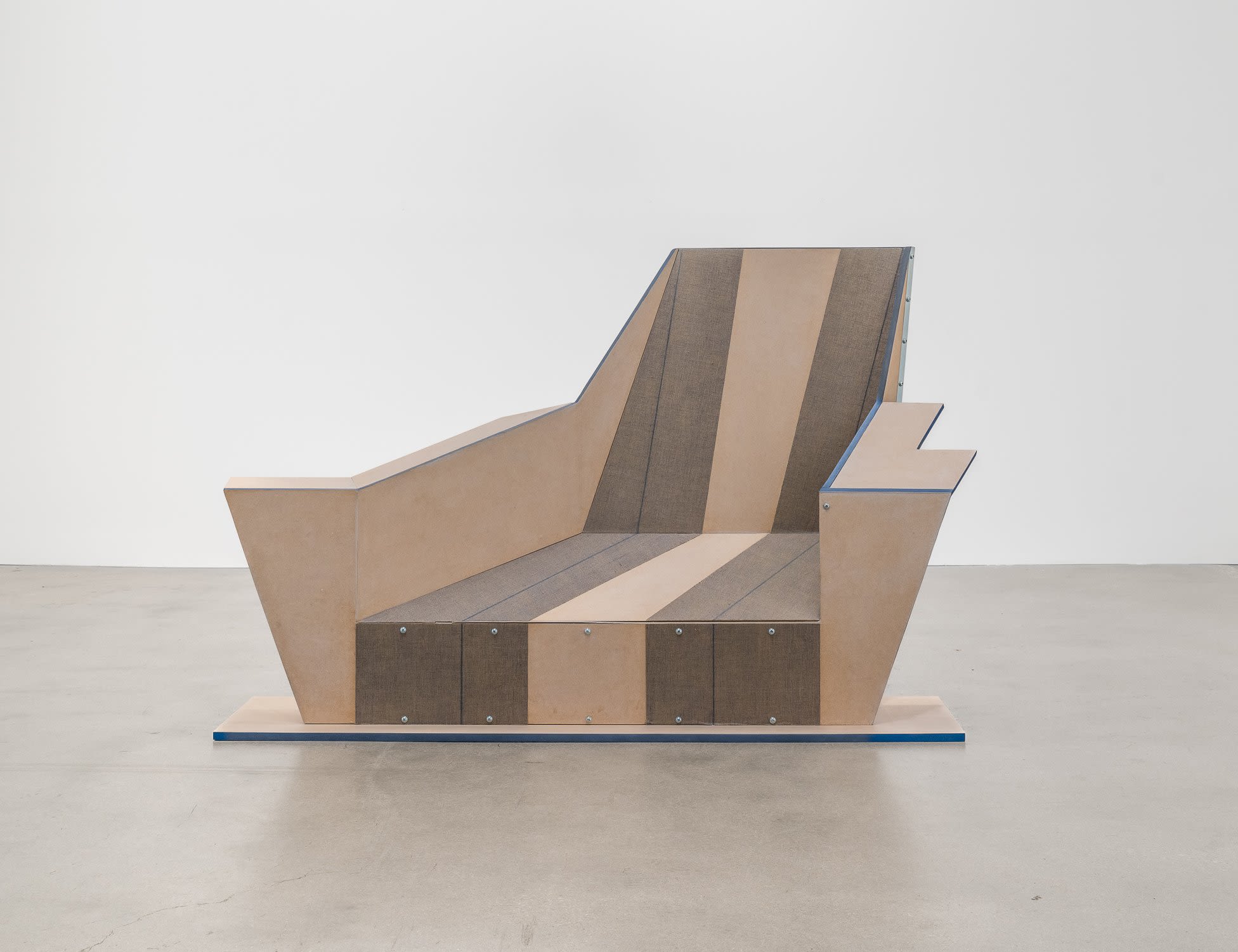 A sculpture that resembles a chair made out of wood