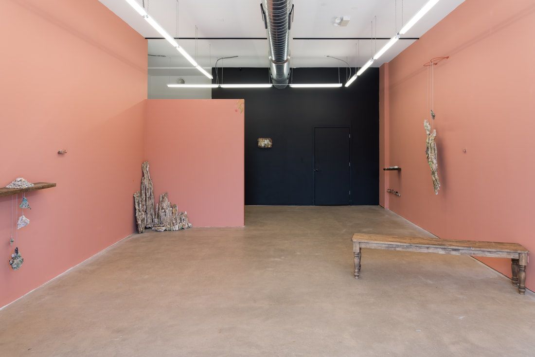 A pink-walled gallery space