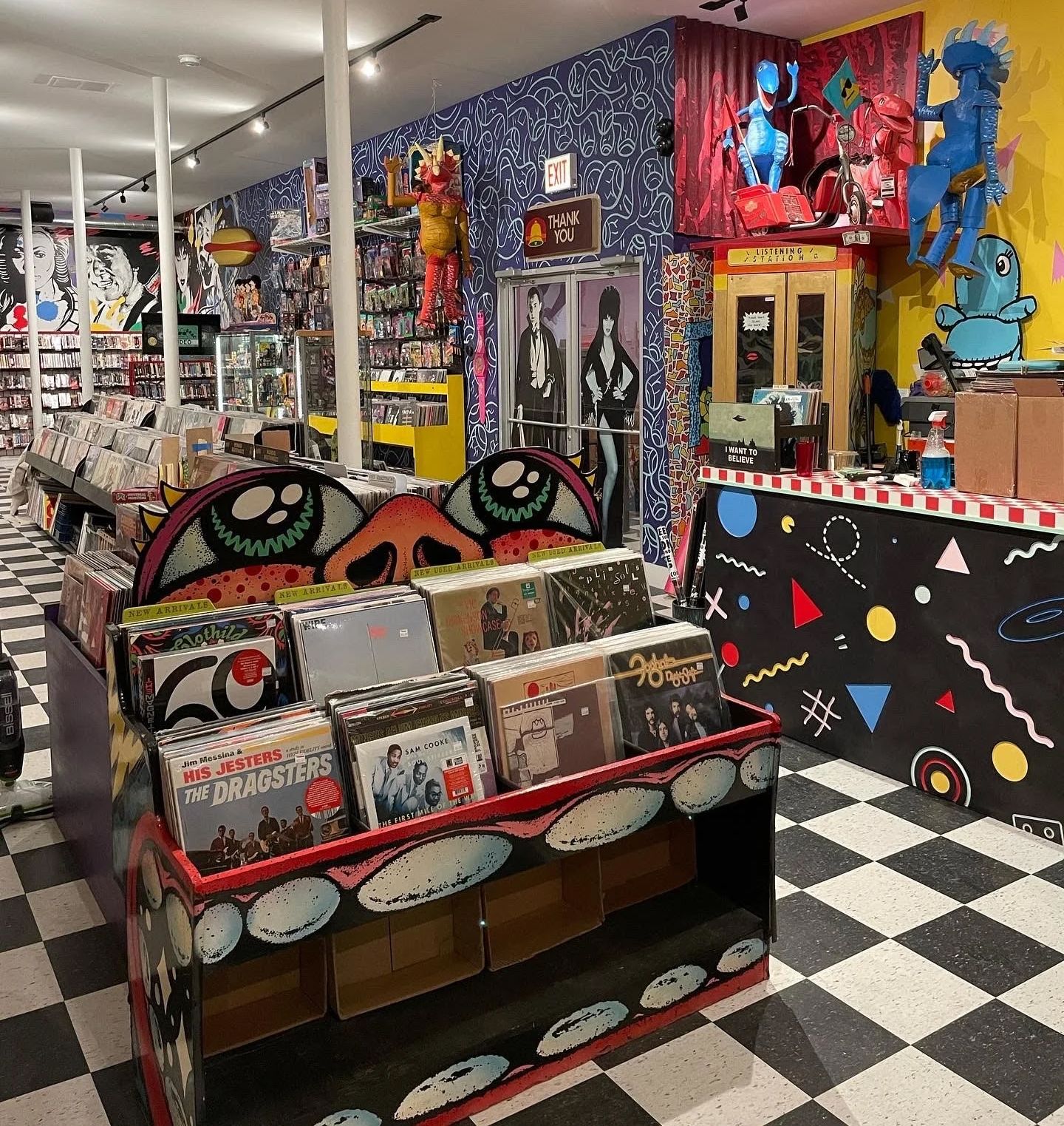The interior of a record store with brightly painted walls