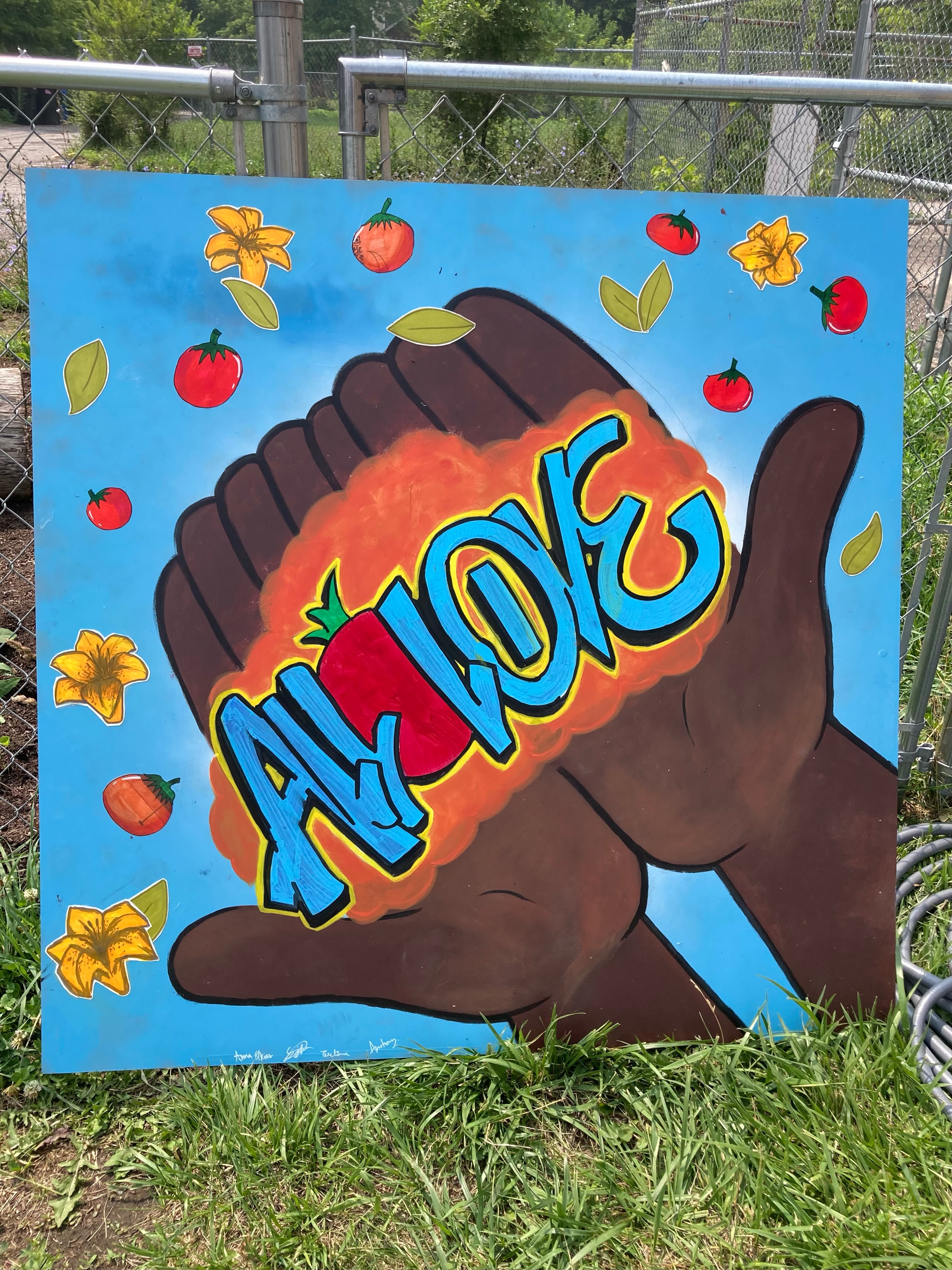 a mural of two hands with the words ALL LOVE