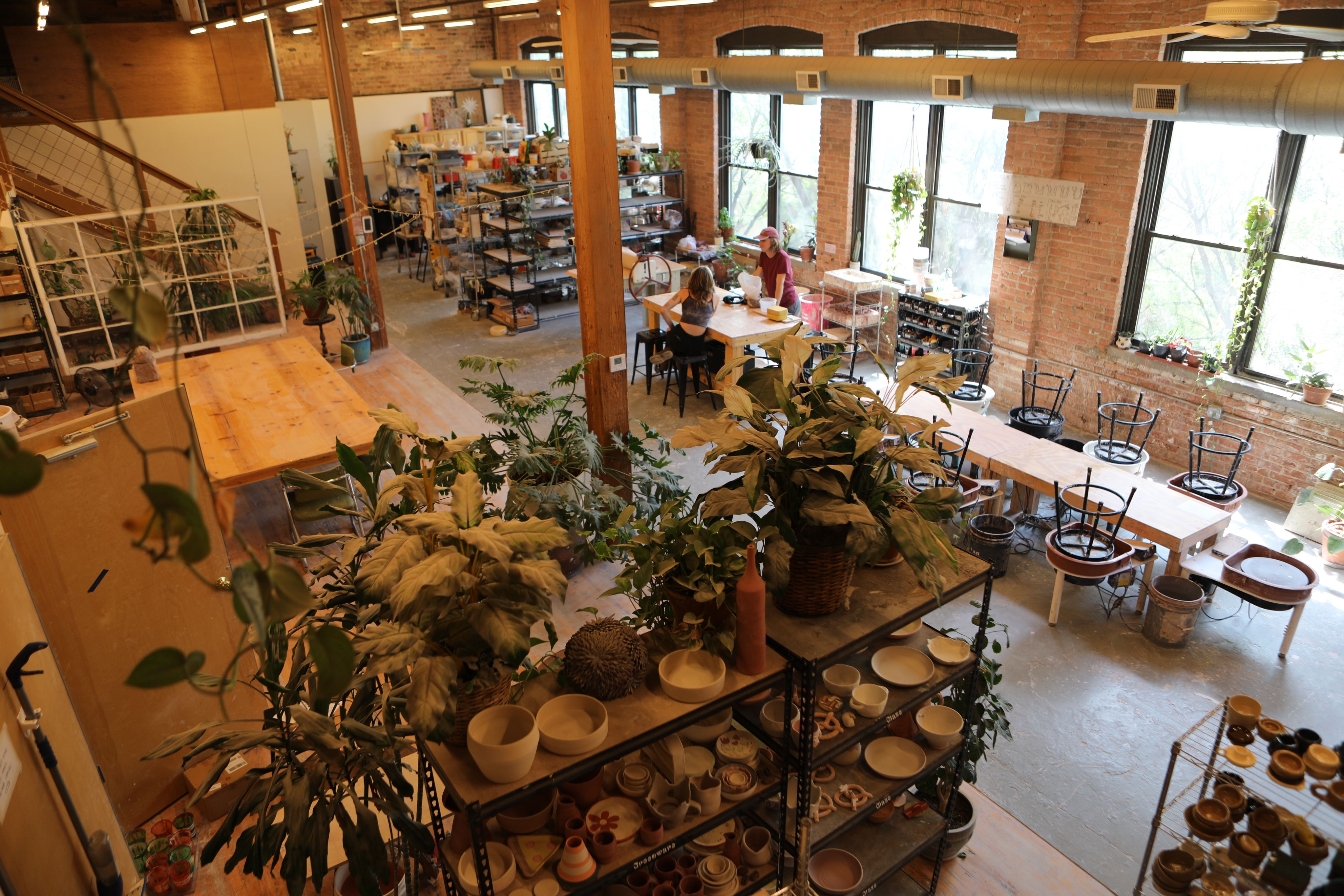 A ceiling view of a brick walled ceramic space