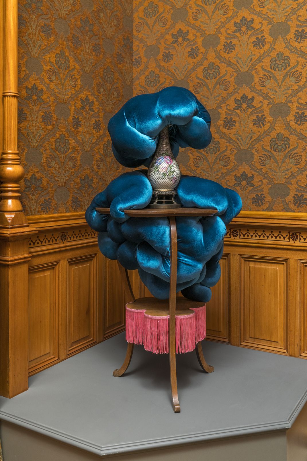 Modern blue fiber art wrapped around an antique side table