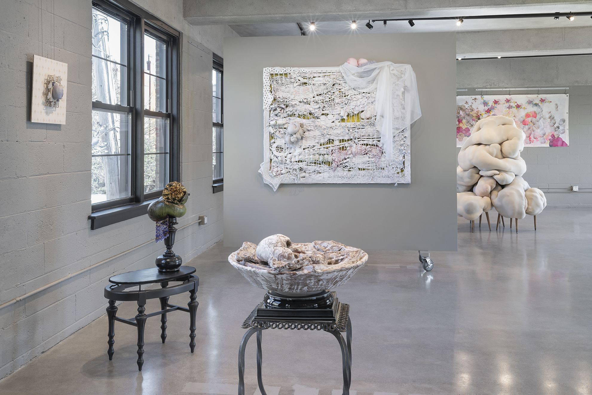 A modern gallery space with different sculptural fiber art