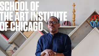 Portrait of Norman Teague, an adult Black person with a medium-dark skin tone, posing with a sculpture. "Fall 2025 School of the Art Institute of Chicago, a Biannual Magazine" is in bold text. 