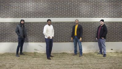 Image of people in front of a building.