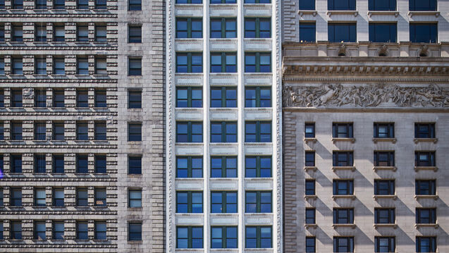 Three tall buildings in downtown Chicago.