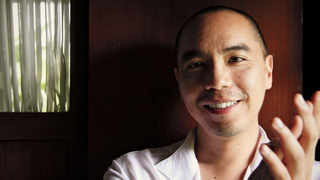 Apichatpong Weerasethakul smiling at the camera