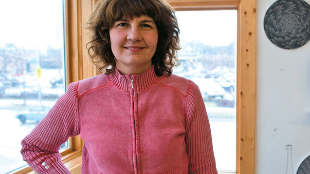 Michelle in a pink shirt smiling at the camera