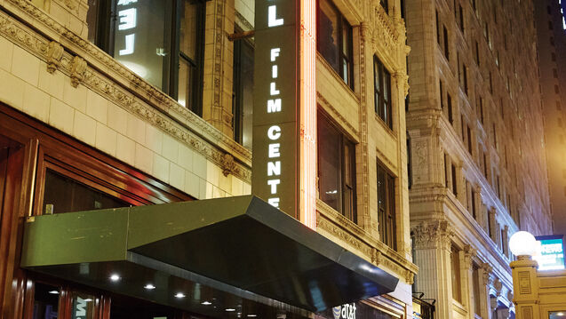 The facade of the Gene Siskel Film Center at night.