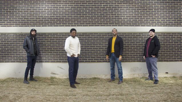 Image of people in front of a building.