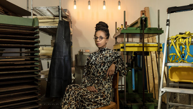 jina valentine sitting in her studio