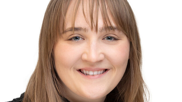 A headshot of Sarah Solberg, assistant director for housing and summer programs